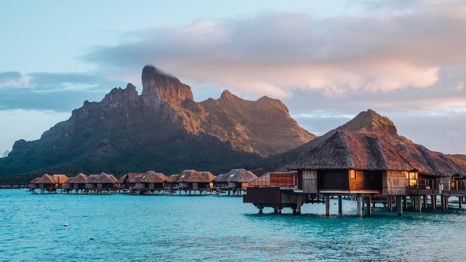 Stunning overwater bungalows at Four Seasons Resort Bora Bora - turquoise lagoon, luxury accommodations, and tropical paradise